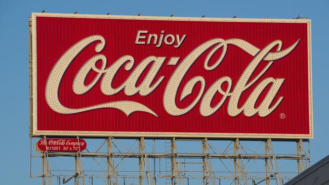 Coca-Cola Co signage is displayed on top of a building on Bryant Street in San Francisco, California, U.S., on Wednesday, Feb. 6, 2013. The Coca-Cola Co. is scheduled to release earnings data on on Feb. 12. Photographer: David Paul Morris/Bloomberg