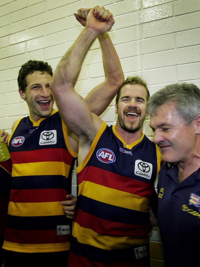 Matthew Clarke and Mark Ricciuto celebrate with Crows coach Neil Craig after winning the 1st Semi-Final in 2005.