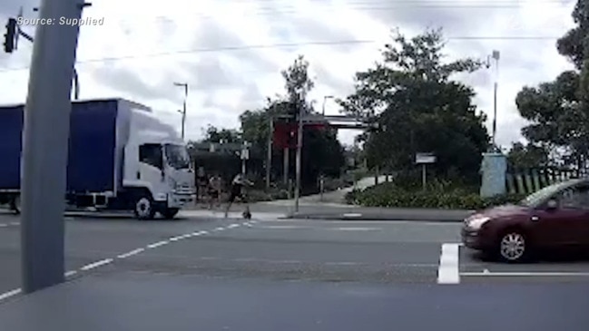 WATCH Shocking footage of man attacked, pushed in front of moving truck in Logan