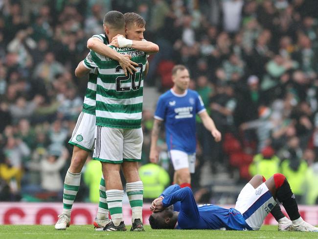 Celtic teammates Carl Starfelt and Cameron Carter-Vickers (20 embrace as fallen Rangers attacker Fashion Sakala shows his despair after the Scottish Cup semi-final. Picture: Ian MacNicol/Getty Images