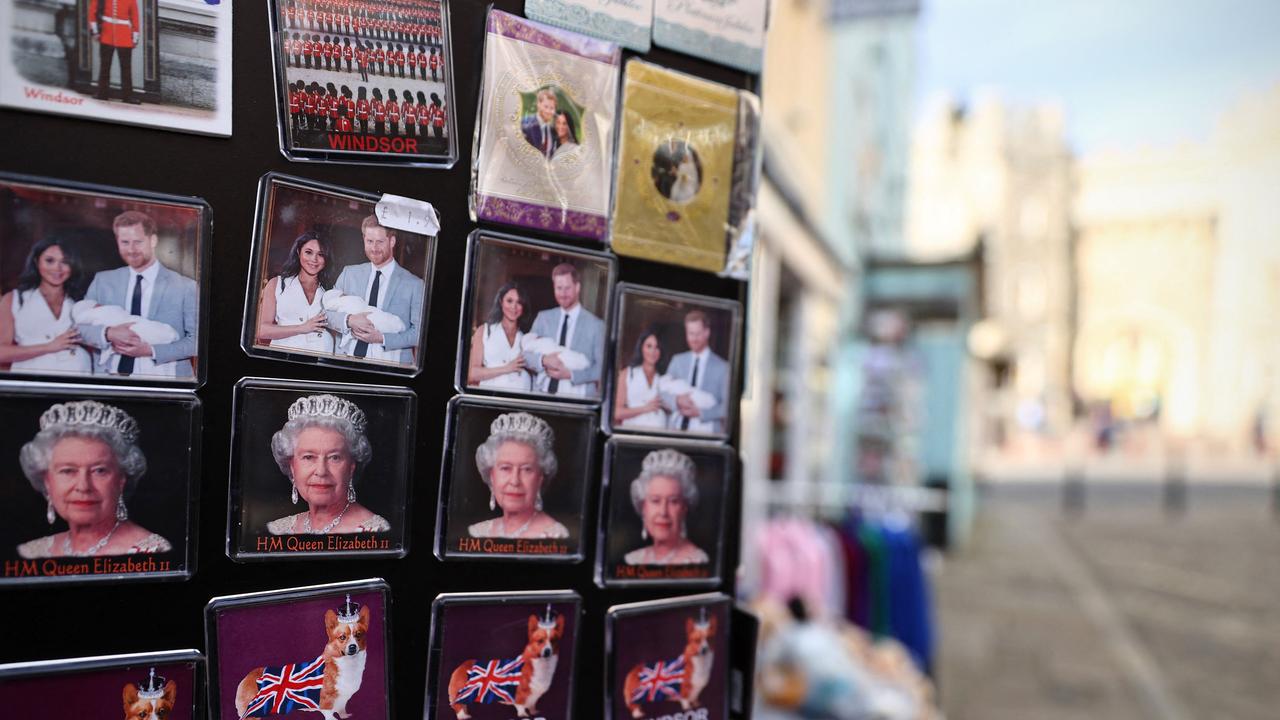 Fridge magnets featuring Britain's Queen Elizabeth II and Prince Harry with his wife Meghan Markle are displayed outside a souvenir shop opposite Windsor Castle. Picture: ADRIAN DENNIS / AFP