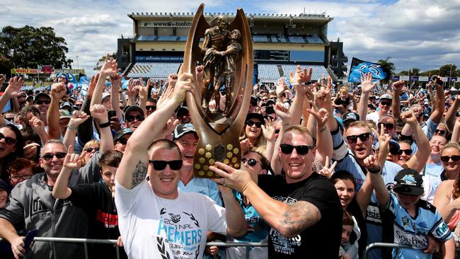 Paul Gallen and Luke Lewis show off the trophy at the Sharks fan day. Picture: Gregg Porteous