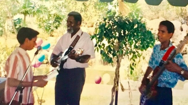 Jeremy Marou on stage with his father and brother Nat. Picture: Supplied.