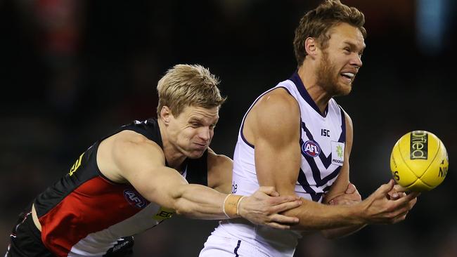 MELBOURNE, AUSTRALIA - JULY 19: Nick Riewoldt of the Saints tackles Paul Duffield of the Dockers during the round 18 AFL match between the St Kilda Saints and the Fremantle Dockers at Etihad Stadium on July 19, 2014 in Melbourne, Australia. (Photo by Michael Dodge/Getty Images)