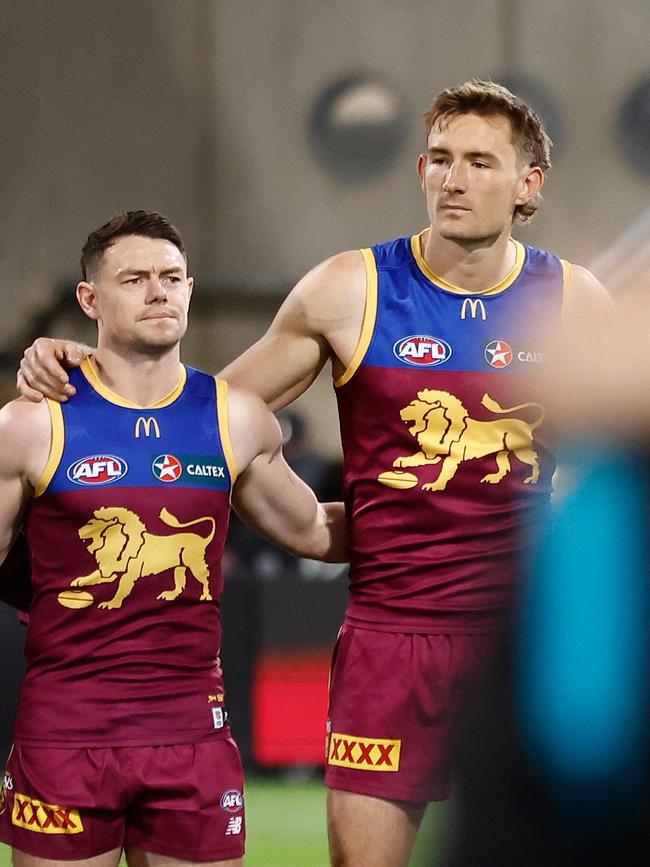 BRISBANE, AUSTRALIA - SEPTEMBER 09: (L-R) Chris Fagan, Lachie Neale and Harris Andrews of the Lions line up for the national anthem during the 2023 AFL Second Qualifying Final match between the Brisbane Lions and the Port Adelaide Power at The Gabba on September 09, 2023 in Brisbane, Australia. (Photo by Michael Willson/AFL Photos via Getty Images)