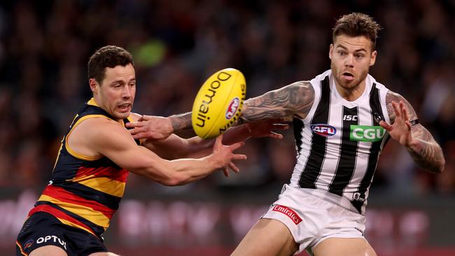 Luke Brown (left) has played 150 games for Adelaide since being drafted in 2011. Picture: James Elsby/AFL Photos via Getty Images