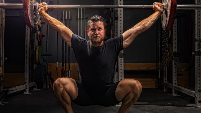 Does the gain justify the pain? Brock Kehler lifts weights at University High in Morgantown, West Virginia on August 1 this year. Picture: Getty Images