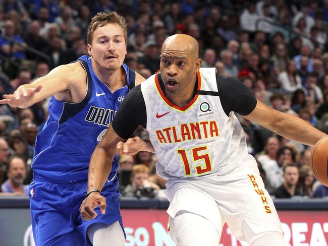 Australian Ryan Broekhoff (left) during a game with the Dallas Mavericks will not be able to join his new 76ers teammates after his wife tested positive for COVID-19. Picture: AP