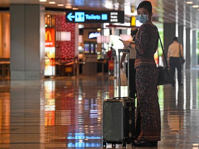 A Singapore Airlines stewardess: Singapore is keen to resume corporate travel between countries with similar testing regimes. Picture: Roslan Rahman/AFP