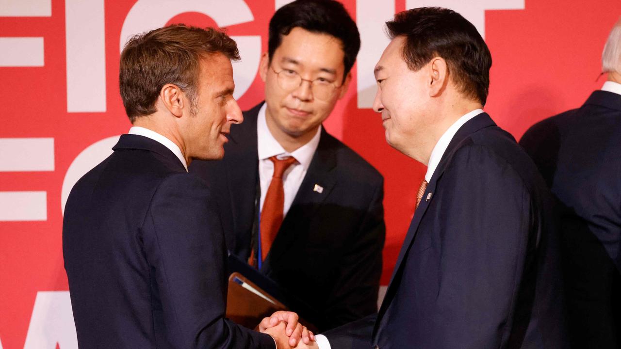 French President Emmanuel Macron shakes hands with South Korean President Yoon Suk-yeol (right) at the end of the Global Fund Seventh Replenishment Conference in New York on September 21. Picture: Ludovic Marin/AFP