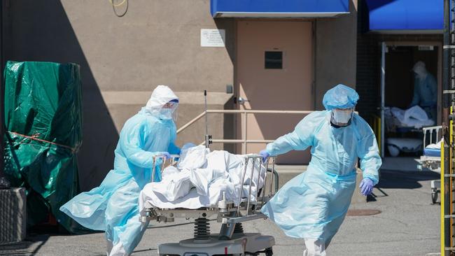 Bodies are moved to a refrigeration truck in Brooklyn, New York. Picture: AFP.