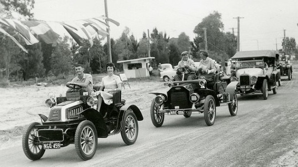 A procession of vintage cars at Bribie Bridge opening. Picture: Queensland State Archives