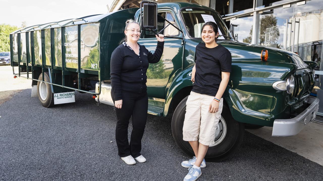 Natasha Brent (left) of JJ Richards with Victoria Ramos and JJ Richards replica Bedford that operated in Toowoomba in 1962. Picture: Kevin Farmer