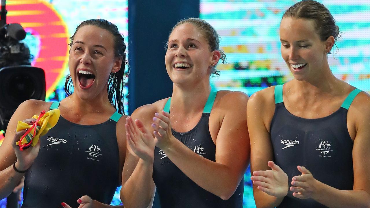 GOLD COAST, AUSTRALIA — APRIL 07: Brianna Throssell, Leah Neale and Emma McKeon of Australia cheer on teammate Ariarne Titmus during the Women's 4 x 200m Freestyle Relay Final on day three of the Gold Coast 2018 Commonwealth Games at Optus Aquatic Centre on April 7, 2018 on the Gold Coast, Australia. (Photo by Scott Barbour/Getty Images)