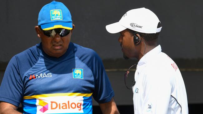 Sri Lanka manager Asanka Gurusinha  makes his point to the fourth umpire.