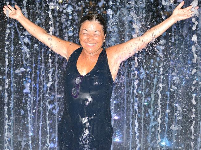 A Portuguese tourist copes with a hot Adelaide night with the help of the Victoria Square fountain at 10pm, when the temperature in the city was above 32C. Picture: Bernard Humphreys