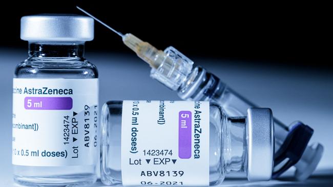 (FILES) This file illustration photo taken on March 11, 2021 shows vials of the AstraZeneca Covid-19 vaccine and a syringe in Paris on March 11, 2021. - The EU's drugs regulator said on March 18, 2021 that the AstraZeneca vaccine was "safe and effective" and was not linked to an increased risk of blood clots. (Photo by JOEL SAGET / AFP)