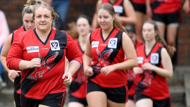 Lisa Walshe leads Knox out at Shultz Reserve prior to her 200th game on Saturday. Picture: Andy Brownbill