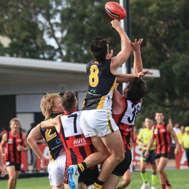 New Balwyn centre half-back Michael Casey flies for a spoil. Picture: Davis Harrigan