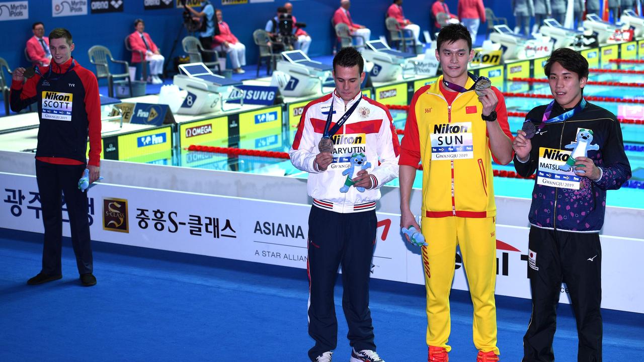 Britain’s Duncan Scott poses for a photo away from gold medallist Sun Yang. (Photo by Oli SCARFF / AFP)