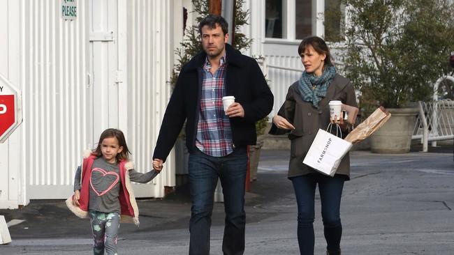 Ben Affleck and Jennifer Garner with their daughter Seraphina in 2014 in Los Angeles, California. (Photo by Bauer-Griffin/GC Images)