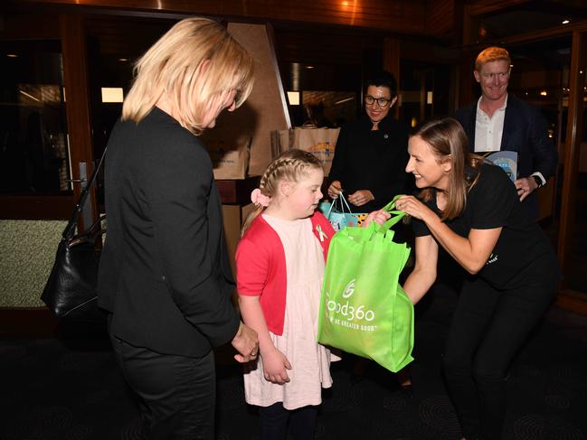 Katia Kovalchuk, 9, receiving her goody bag. Picture: Naomi Jellicoe