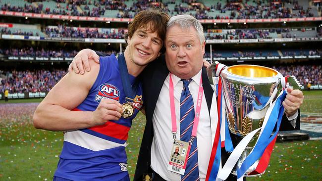 Liam Picken and Bulldogs president Peter Gordon celebrate the 2016 premiership. Picture: Mark Stewart