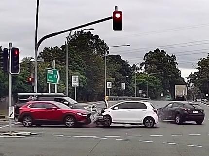 The white hatchback spun around, colliding with the red SUV. Picture: Dashcam Owners Australia