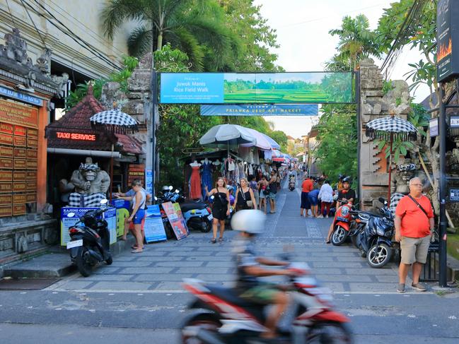 Ubud, Bali in Indonesia - January 30 2024: local people enjoy the city by motorbike