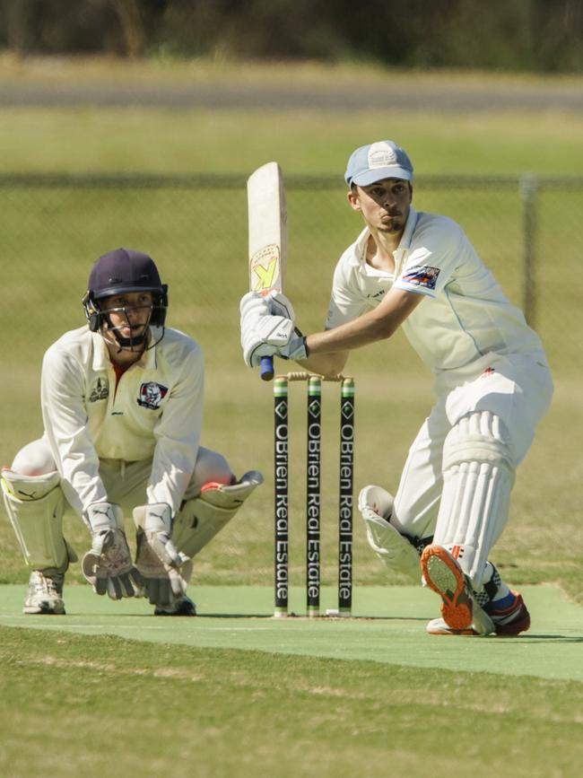 Langwarrin’s Matt Prosser sweeps. Picture: Valeriu Campan