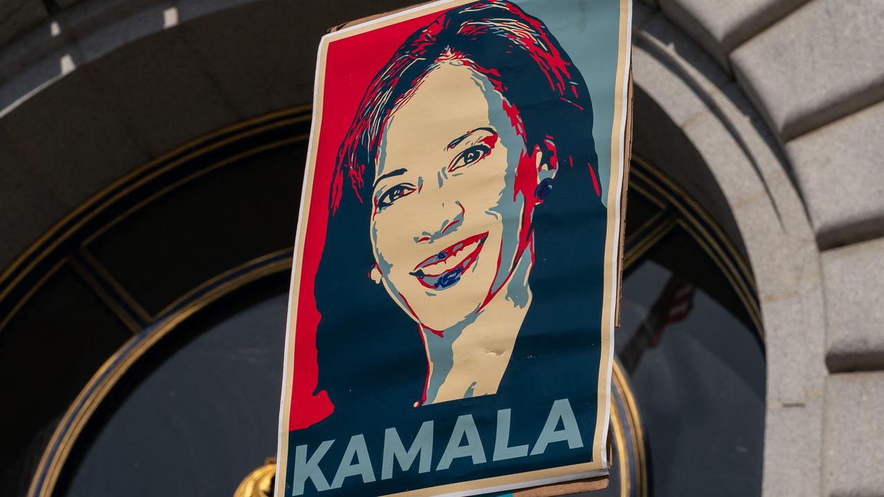 A supporter holds a sign as members of the San Francisco Democratic Party rally in support of Kamala Harris. Picture” Loren Elliott/Getty/AFP