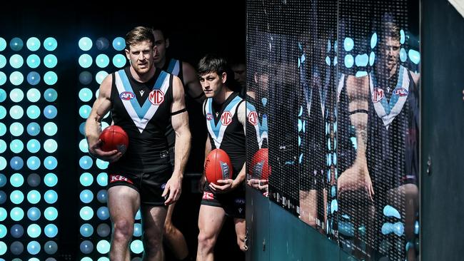 Tom Jonas leads the Power out for what may be his final game. Picture: Mark Brake/Getty Images