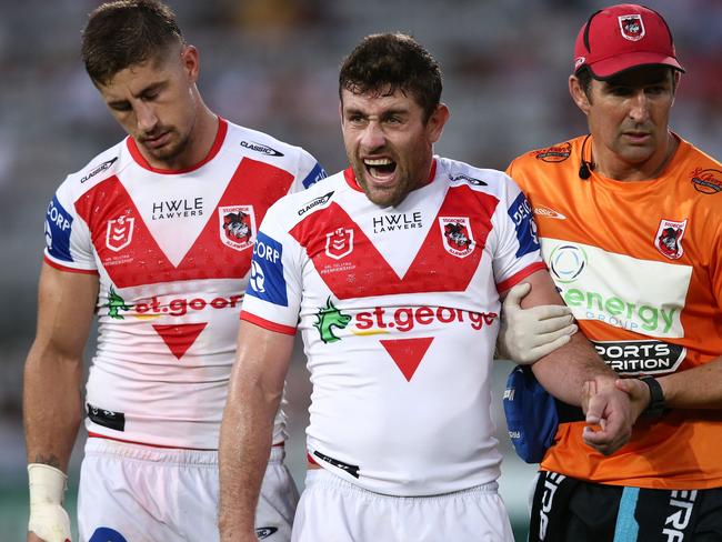 Andrew McCullough (centre) has opted to retire despite having a year left to run on his contract. Picture: Jason McCawley/Getty Images