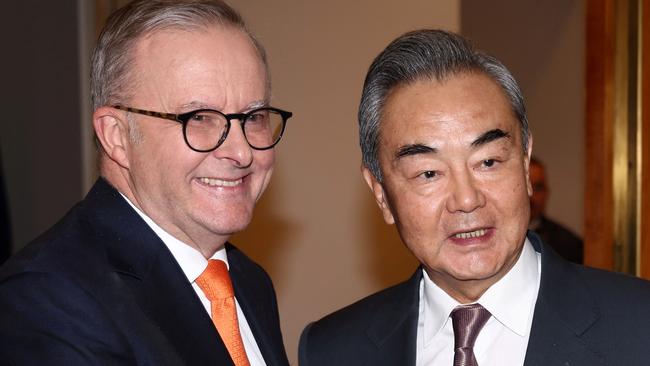 Australian Prime Minister Anthony Albanese (L) receives Chinese Foreign Minister Wang Yi for a meeting in Canberra on March 20, 2024. Wang began a whirlwind visit to Australia on his rare trip marking a thaw in relations between the two trading partners. (Photo by David GRAY / AFP)