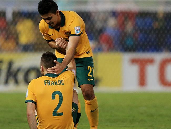 Australia's Massimo Luongo celebrates Australia's 2-0 win with team mate Ivan Franjic during the Asian Cup semi final between Australia and United Arab Emirates (UAE) at Hunter Stadium in Newcastle. Picture: Toby Zerna