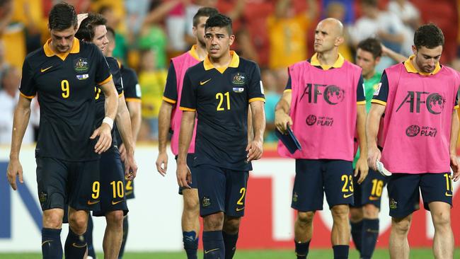 BRISBANE, AUSTRALIA - JANUARY 17: Massimo Luongo (C) of the Socceroos and team mates look dejected after losing the 2015 Asian Cup match between Australia and Korea Republic at Suncorp Stadium on January 17, 2015 in Brisbane, Australia. (Photo by Cameron Spencer/Getty Images)