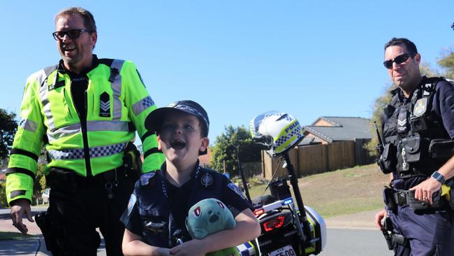 Young Travis was sworn into the Queensland Police Service early last month, fulfilling his lifelong dream. Picture: Queensland Police Service