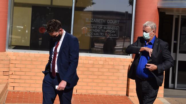 Anthony David Jonathan Skewes leaves the Elizabeth Magistrates Court, with his father following. Picture Jason Katsaras