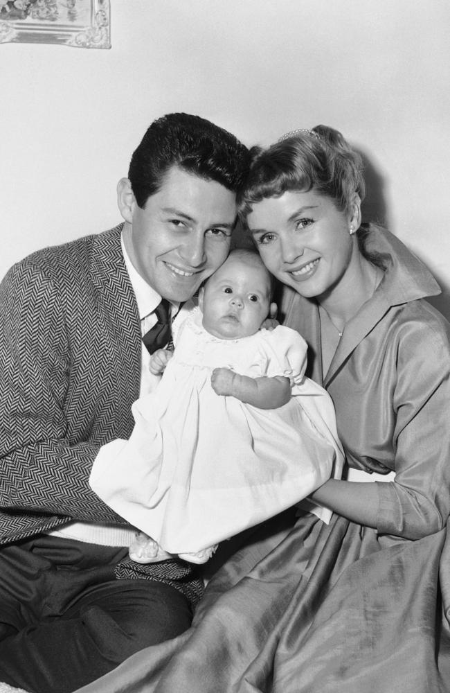 Eddie Fisher and Debbie Reynolds hold their baby daughter, Carrie Frances Fisher. Picture: AP