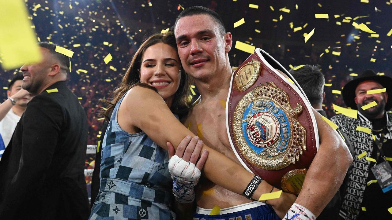 Tim Tszyu celebrates with his partner Alexandra Constantine following his victory over USA's Tony Harrison. Photo by Saeed KHAN / AFP.