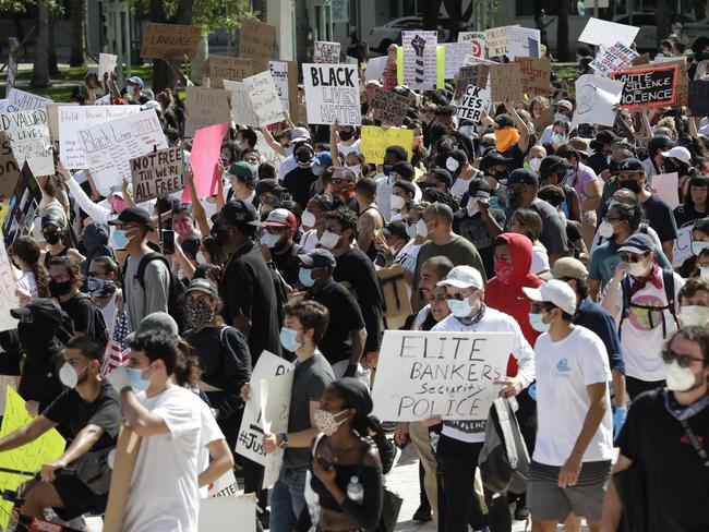 Protesters march in downtown Miami. Picture: AP