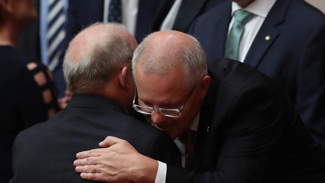 PM Scott Morrison, right, congratulating Senator John Williams after he delivered his Valedictory speech. Picture: Kym Smith