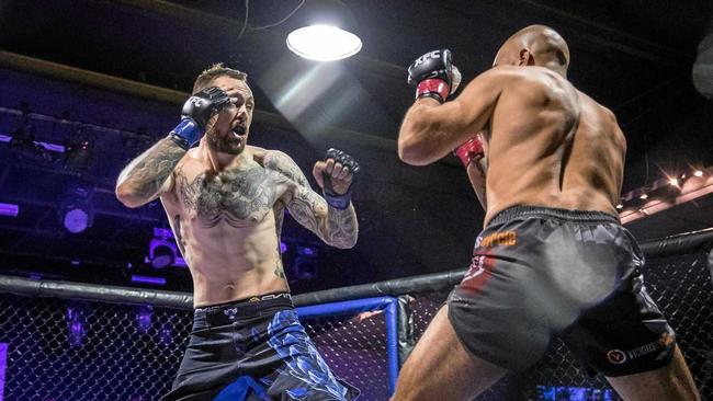 Zane Brassington (left) in action at the start of a fight he won by a TKO after 15 seconds  in mixed martial arts. Picture: Contributed