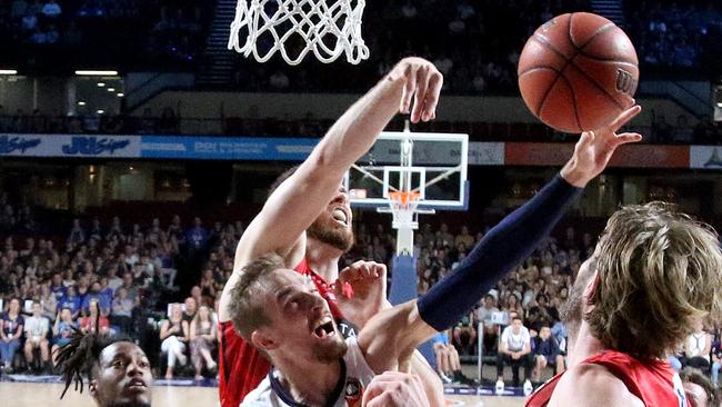 Anthony Drimic of the 36ers rebounds the ball among Wildcat players during the Round 13 NBL match between Adelaide United and Perth Wildcats at the Adelaide Entertainment Centre in Adelaide, Wednesday, January 1, 2020. (AAP Image/Kelly Barnes)