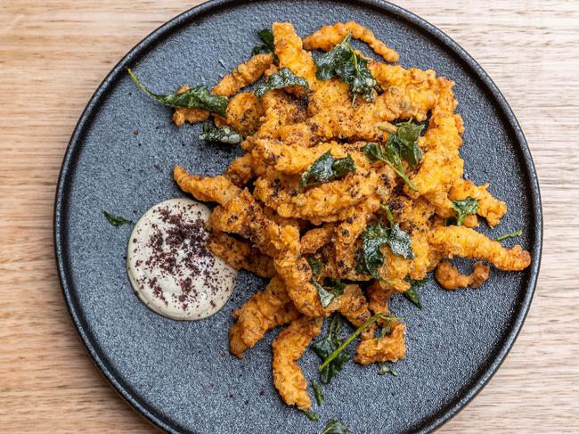 Salt bush and pepper berry fried crocodile with smoked oyster aioli. Picture: Jake Nowakowski.