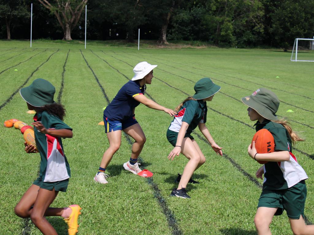 Mega Gallery: Adelaide Crows AFLW stars mix it with Whitfield State School  | The Advertiser