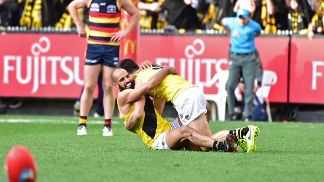 Bachar Houli hugs Trent Cotchin at the final siren. Picture: Stephen Harman