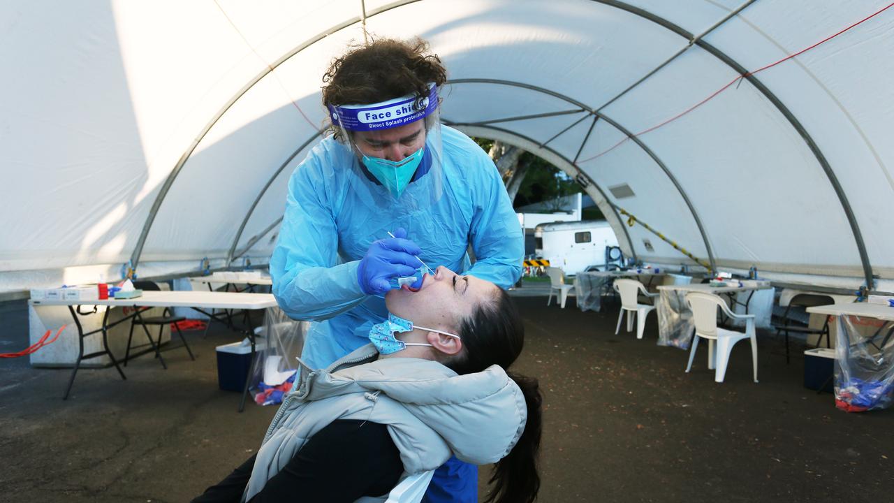 A nurse conducts a Covid-19 swab test at the Rushcutters Bay mobile Covid testing clinic. Picture: Lisa Maree Williams/Getty Images