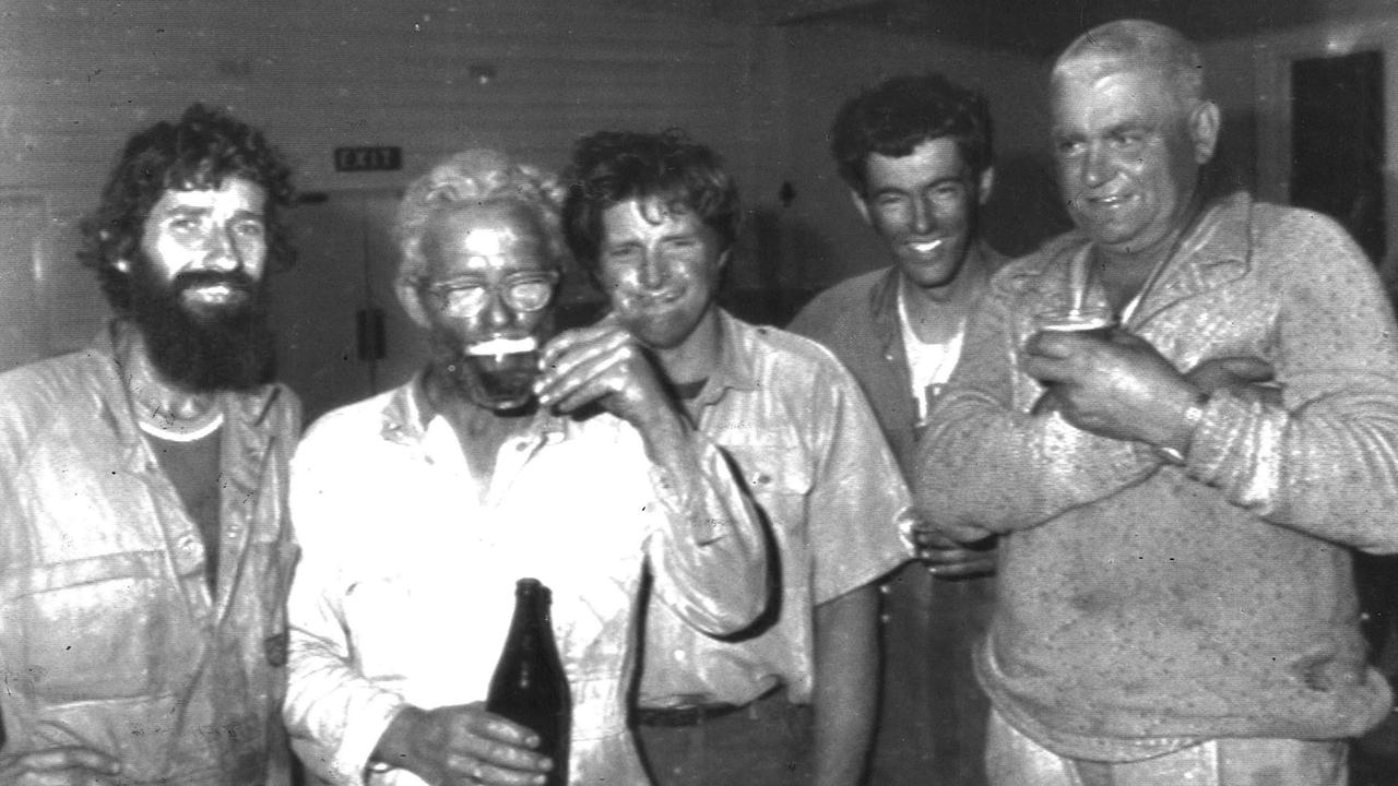 Weary firefighters take a break at Lorne during the Ash Wednesday bushfires.