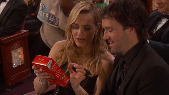 Kate Winslet nabs a box of cookies.